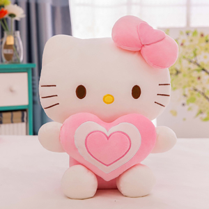 Hello Kitty plysch med ett hjärta som sitter på ett bord