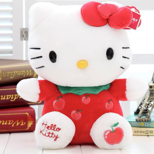 Söt Hello Kitty-plysch med röd fjäril som sitter framför böcker